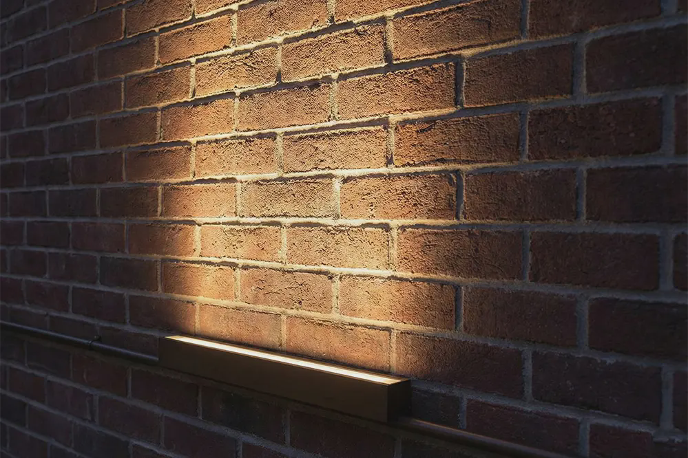 Types of Beam Angles for LED Strip Lights" section Alt Text: Narrow beam angle LED strip creating dramatic wall washing effect on textured architectural surface