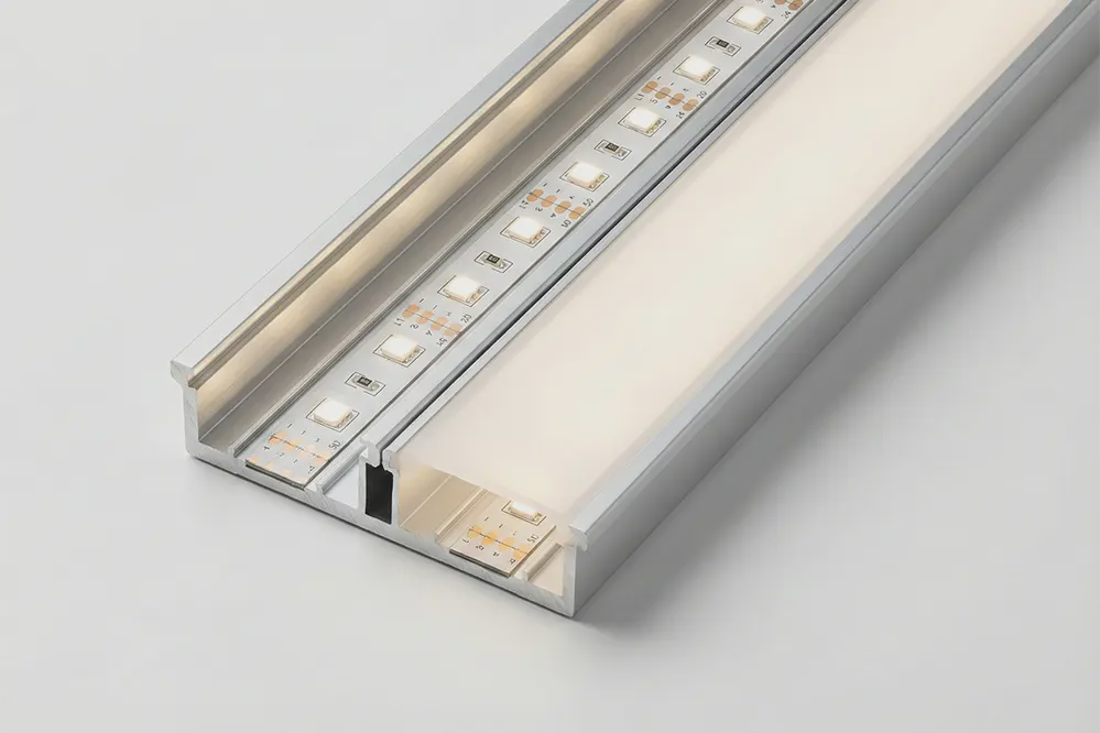 LED strip in aluminum channel with frosted diffuser modifying beam angle distribution and reducing hotspots